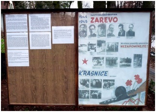 Informační tabule památníku padlých partyzánů